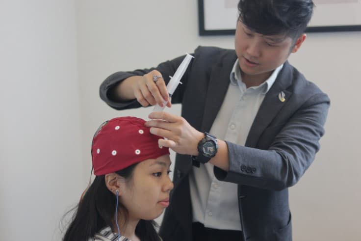 Dr. Tim Foo conducting a neurological assessment